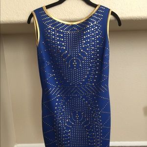 Dress, cobalt blue and gold studs. Above the knee.
